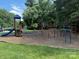 Community playground featuring a slide, swings, and climbing structures, providing a fun space for  at 107 Monterey Dr, Mooresville, NC 28117