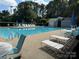 Inviting community pool with lounge chairs and umbrellas, perfect for relaxing on sunny days at 107 Monterey Dr, Mooresville, NC 28117