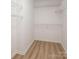 Walk-in closet featuring wire shelving and wood-look floors at 107 Monterey Dr, Mooresville, NC 28117