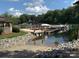 Stunning waterfront view featuring a gazebo, boat dock, and lush greenery, offering a serene lakeside experience at 107 Monterey Dr, Mooresville, NC 28117