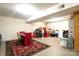 Spacious basement area with a dining set, office equipment, and ample storage boxes at 3092 Lee Lawing Rd, Lincolnton, NC 28092