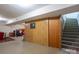 Basement with stairs, wood paneling, and a glimpse of other room features at 3092 Lee Lawing Rd, Lincolnton, NC 28092