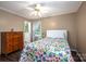 Comfortable bedroom with wooden floors, colorful bedspread, and lots of natural light at 3092 Lee Lawing Rd, Lincolnton, NC 28092