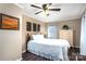 Cozy bedroom showcasing hardwood floors, ceiling fan, and ample natural light at 3092 Lee Lawing Rd, Lincolnton, NC 28092