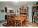 Traditional dining room with wooden table set and china cabinet near kitchen at 3092 Lee Lawing Rd, Lincolnton, NC 28092
