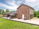Brick home featuring a covered patio with a dining area perfect for outdoor entertaining at 3092 Lee Lawing Rd, Lincolnton, NC 28092