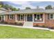 Close-up of charming front porch, adorned with classic brickwork and inviting decor at 3092 Lee Lawing Rd, Lincolnton, NC 28092