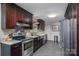 Updated kitchen featuring stainless appliances, granite countertops, and plenty of cabinet space at 3092 Lee Lawing Rd, Lincolnton, NC 28092