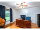 Bright office with hardwood floors, ceiling fan, and natural light from the large window at 3092 Lee Lawing Rd, Lincolnton, NC 28092