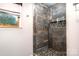 Modern shower with decorative tiles and a window providing natural light at 3092 Lee Lawing Rd, Lincolnton, NC 28092