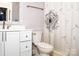 Clean bathroom with white cabinets and dandelion shower curtain at 4130 Charlotte Hwy # G, Lake Wylie, SC 29710