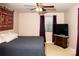 Bright bedroom with a comfortable bed and large TV at 4130 Charlotte Hwy # G, Lake Wylie, SC 29710