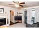 Living room with fireplace, TV, and access to balcony at 4130 Charlotte Hwy # G, Lake Wylie, SC 29710