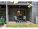 Private patio with wooded views and seating for two at 4130 Charlotte Hwy # G, Lake Wylie, SC 29710