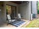 Cozy patio with chairs and a table, perfect for relaxing outdoors at 4130 Charlotte Hwy # G, Lake Wylie, SC 29710