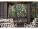 Screened porch with wooded views and comfortable chairs at 4130 Charlotte Hwy # G, Lake Wylie, SC 29710