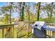 Wooden deck with grill and stairs leading to yard at 4401 Trace Ave, Gastonia, NC 28056