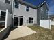 A patio with privacy fence in the backyard of a two-story home at 6259 Tea Olive Dr # 178, Harrisburg, NC 28075