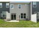 View of backyard featuring lawn, patio, and the back of the house at 6259 Tea Olive Dr # 178, Harrisburg, NC 28075
