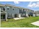 Townhome backyards with small patios and green lawns at 6259 Tea Olive Dr # 178, Harrisburg, NC 28075