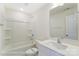 A clean and stylish bathroom featuring a combination tub and shower, modern vanity, and a large mirror at 6259 Tea Olive Dr # 178, Harrisburg, NC 28075