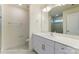 Modern bathroom with a quartz countertop, white cabinets, and tiled shower at 6259 Tea Olive Dr # 178, Harrisburg, NC 28075