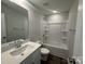 Bathroom with tub, quartz countertops, and white cabinets at 6259 Tea Olive Dr # 178, Harrisburg, NC 28075