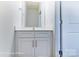 Well-lit bathroom with a white vanity and modern fixtures at 6259 Tea Olive Dr # 178, Harrisburg, NC 28075