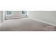 Inviting bedroom with neutral carpet, natural light, and crisp, white trim at 6259 Tea Olive Dr # 178, Harrisburg, NC 28075
