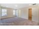 Bedroom with neutral carpet, walk-in closet, and natural light at 6259 Tea Olive Dr # 178, Harrisburg, NC 28075