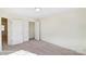 Bright bedroom with carpet, featuring a closet with sliding doors and a view to the outside offering comfort and style at 6259 Tea Olive Dr # 178, Harrisburg, NC 28075