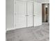 Bedroom view featuring double closet doors and neutral carpet at 6259 Tea Olive Dr # 178, Harrisburg, NC 28075