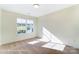 Sunlit bedroom with a large window offers an airy feel and a view of the neighborhood perfect for relaxation at 6259 Tea Olive Dr # 178, Harrisburg, NC 28075