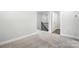 Upstairs bedroom showcasing neutral carpet and an open landing with views to other rooms at 6259 Tea Olive Dr # 178, Harrisburg, NC 28075