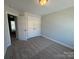 Bedroom with a double closet, carpet flooring, and neutral wall color at 6259 Tea Olive Dr # 178, Harrisburg, NC 28075