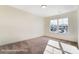 A bright bedroom with a large window providing ample natural light and a pleasant neighborhood view at 6259 Tea Olive Dr # 178, Harrisburg, NC 28075
