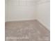 Spacious walk-in closet with ample shelving for organization and storage enhancing your home organization at 6259 Tea Olive Dr # 178, Harrisburg, NC 28075