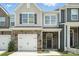Stylish townhome with mixed materials, including stone, shingles, and siding with an available sign at 6259 Tea Olive Dr # 178, Harrisburg, NC 28075