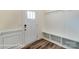 Foyer entrance with a white door, coat hooks and wooden floors at 6259 Tea Olive Dr # 178, Harrisburg, NC 28075
