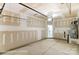 A spacious two car garage with concrete flooring ready to be converted into usable space at 6259 Tea Olive Dr # 178, Harrisburg, NC 28075