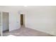 A bright hallway with access to additional rooms and features carpeted floors offers a welcoming transition space at 6259 Tea Olive Dr # 178, Harrisburg, NC 28075
