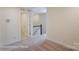 Hallway featuring access to other areas of the home and a staircase with white railings at 6259 Tea Olive Dr # 178, Harrisburg, NC 28075