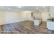 Bright and airy kitchen featuring an island, stainless steel appliances, and hardwood floors at 6259 Tea Olive Dr # 178, Harrisburg, NC 28075