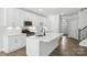 Contemporary kitchen with white cabinetry, large island, and stainless steel appliances at 6259 Tea Olive Dr # 178, Harrisburg, NC 28075