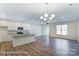 Spacious kitchen with island, modern appliances, hardwood floors, and a bright, open floor plan at 6259 Tea Olive Dr # 178, Harrisburg, NC 28075