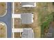 Aerial view of roofs of homes in a well-maintained neighborhood with trees and lawns at 7618 Fenn Way, Indian Land, SC 29707