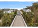 A beautiful aerial shot of a quiet street lined with attractive homes with lush landscaping at 7618 Fenn Way, Indian Land, SC 29707