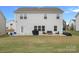 Spacious backyard featuring a well-maintained lawn, patio area, and view of the property at 7618 Fenn Way, Indian Land, SC 29707
