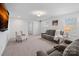 Basement with a neutral color scheme with cozy recliners, a comfortable armchair, and a wall-mounted TV at 7618 Fenn Way, Indian Land, SC 29707