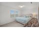 Well-lit bedroom with a queen bed, side table and a window offering natural light at 7618 Fenn Way, Indian Land, SC 29707